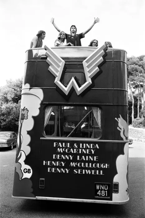 Framed Print : Paul McCartney and his wife Linda in Paris, France, with other members of the group Wings