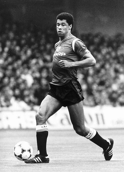 Paul McGrath of Manchester United in action against Queens Park Rangers durinf their