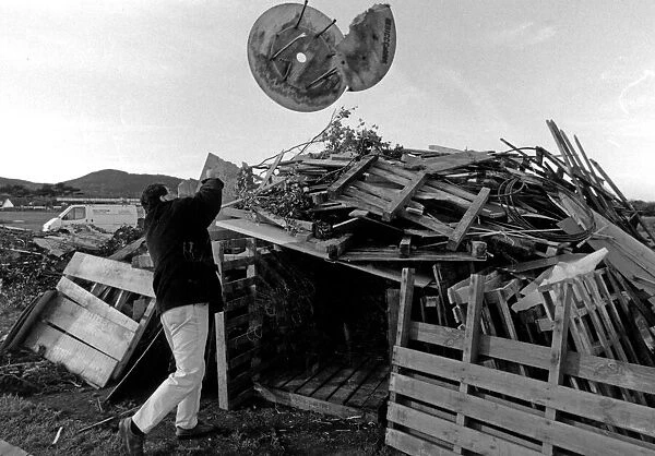 Paul Roberts of Abergele Round Table building a bonfire. 9th November 1995
