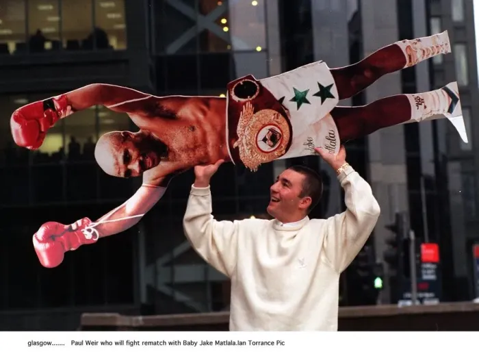 Framed Print : Paul Weir boxer holds cardboard cut out of Baby Jake Matlala who he will fight in a Framed Print : Paul Weir boxer holds cardboard cut out of Baby Jake Matlala who he will fight in a