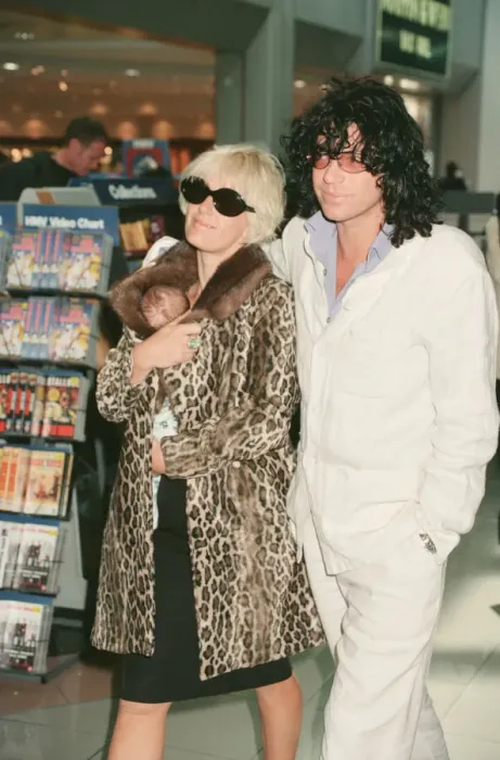 Framed Print : Paula Yates and her boyfriend, INXS singer Michael Hutchence leave Heathrow Airport for
