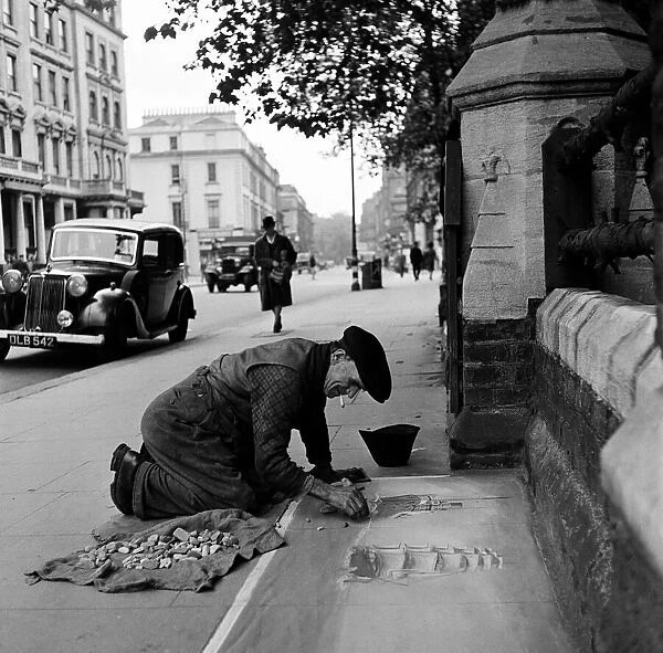 Pavement Artist at work in Gloucester Road, London, 1946