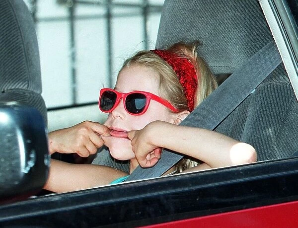 Peaches Yates  /  Geldof pulls a face as she heads off to see her new sister Heavenly