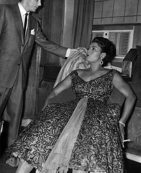 Pearl Bailey, the coloured singer, leaned back in her chair in a dressing room at
