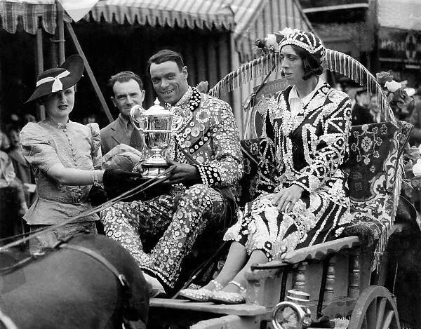 Pearly King and Queen Mr and Mrs Newham and Mrs John Walker presenting to them the 1st