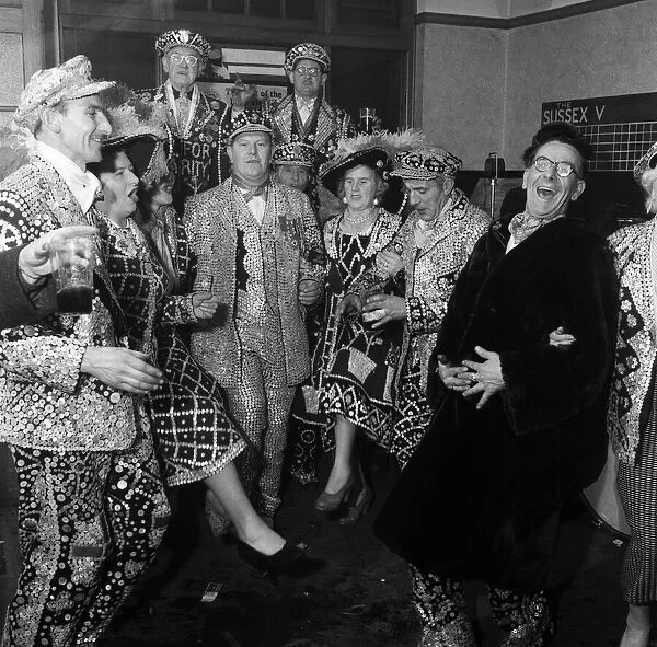 Pearly Kings and Queens celebrating in Hackney, East London. 24th March 1955