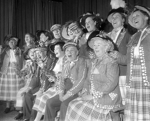 Pearly kings and queens singing during a concert