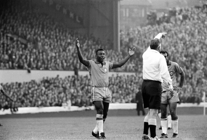 Framed Print : Pele July 1966 raises his hands as the referee awards a free kick in the Scotland v