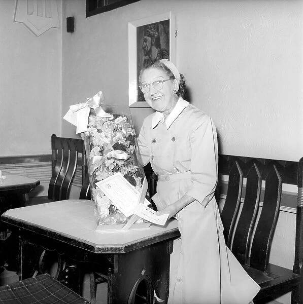 Pensioner with bouquet of flowers: Mrs. Hecklen. July 1957 A485-001