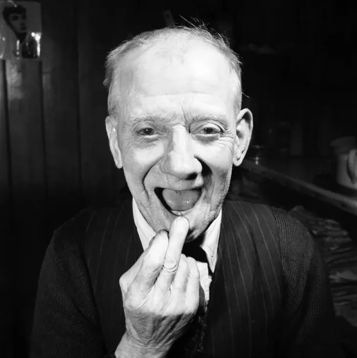 Framed Print : Pensioner with a new tooth. 77 year old man (George Berry) shows off his new tooth