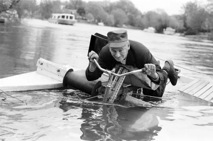 Framed Print : Pensioner Patrick Thomas pictured on his lying down bicycle equipped with floats as he Framed Print : Pensioner Patrick Thomas pictured on his lying down bicycle equipped with floats as he