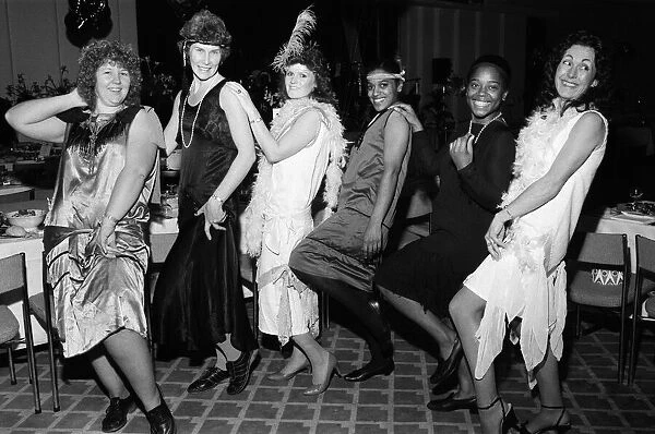 People celebrating New Years Eve at a Roaring Twenties party