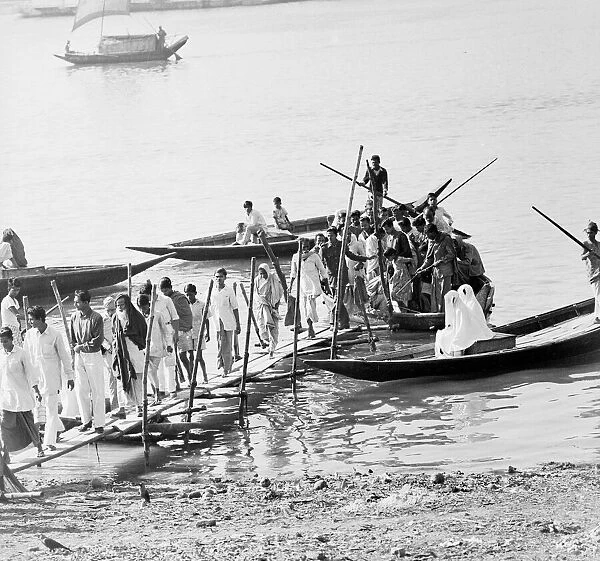 People disembark from a local ferry in Dacca, Bangladesh. Feburary 1961 l