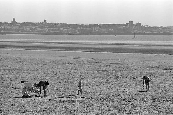 People enjoying a day at Crosby beach. Crosby, Merseyside. 1st August 1990