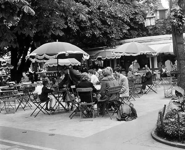 People enjoying refreshments at a outdoor cafe, Southport, Merseyside. 5th August 1959