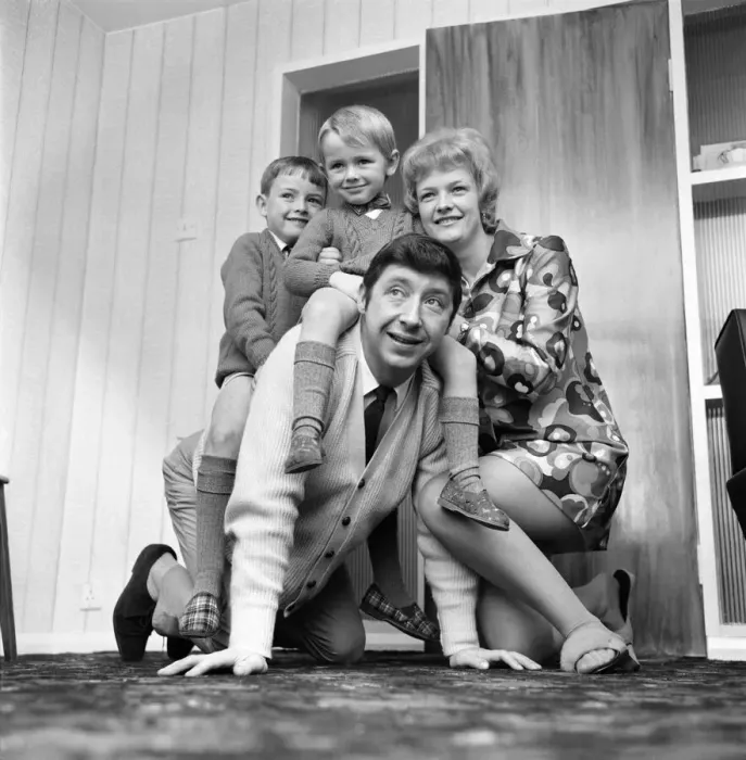Framed Print : People: Families. Man at home with his wife and playing with children Framed Print : People: Families. Man at home with his wife and playing with children