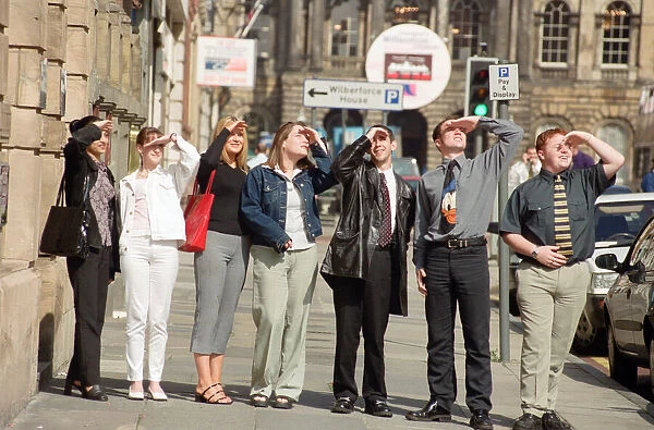 People in Liverpool city centre watching the solar eclipse. 11th August 1999