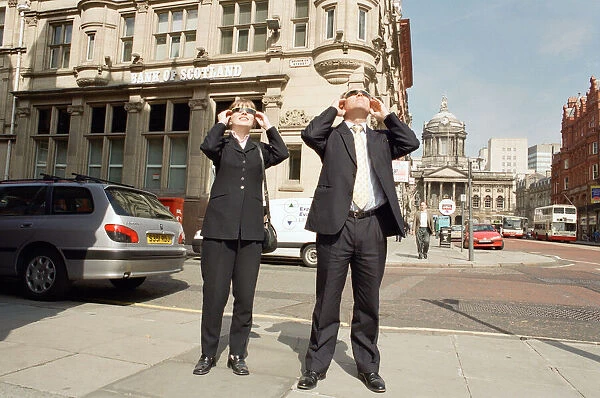 People in Liverpool city centre watching the solar eclipse. 11th August 1999