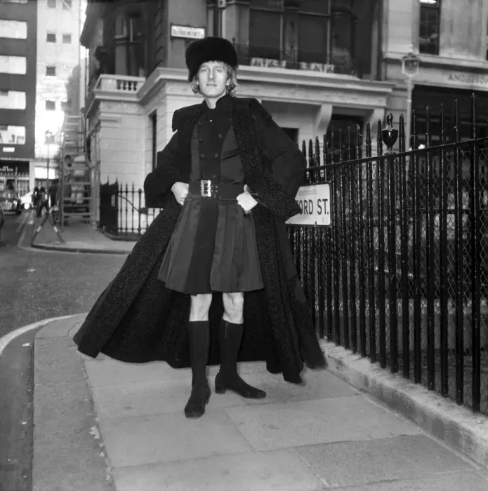 Framed Print : People Men Humour. Fashion Clothing. Mr. Fish wearing a full-length leather maxi coat