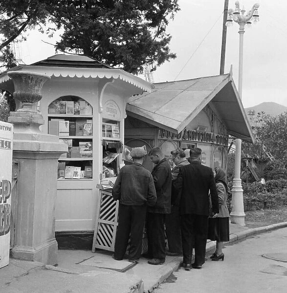 People mill outside a Yalta bookshop and newsagent in the Crimea, USSR. May 1960