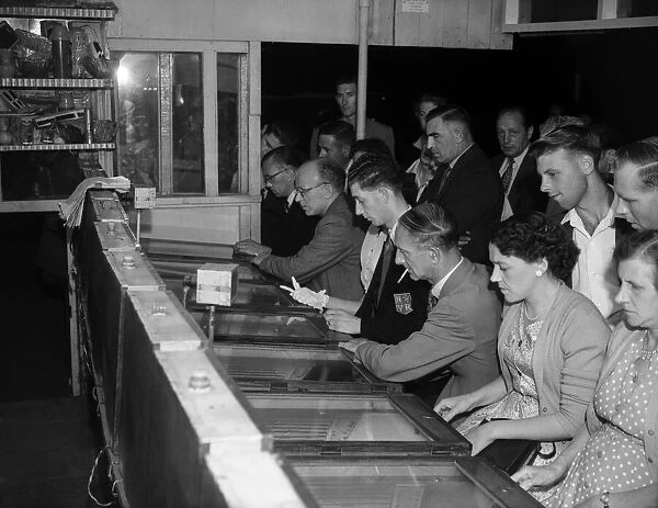 People playing the Twenty One Game in a Sixpenny Casino stall in Blackpool