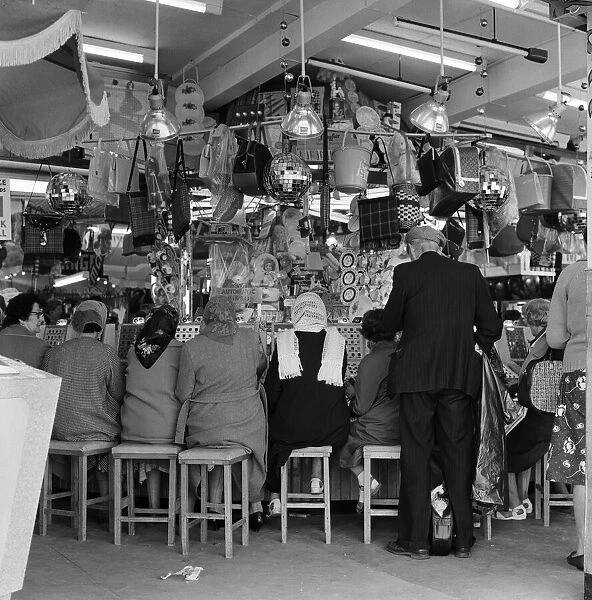 People playing games in an amusement arcade in Scarborough, North Yorkshire. May 1964