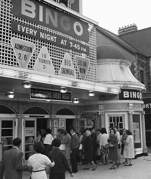People queue outside the Gaiety Theatre, to play bingo. 31st July 1963