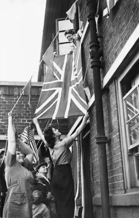 Framed Print : People seen here putting up bunting, Union Jacks and American flags in support of Framed Print : People seen here putting up bunting, Union Jacks and American flags in support of