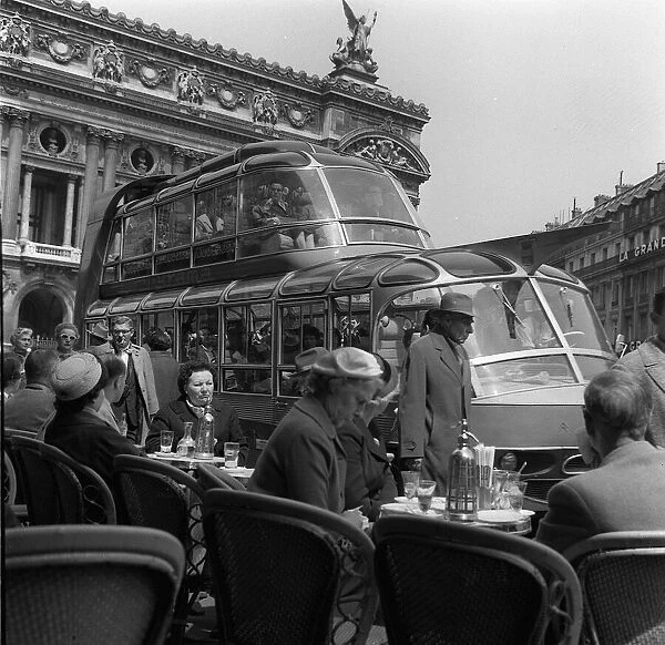 People sitting in front of the Opera Garnier Paris May 1960 on a cafe terrace with