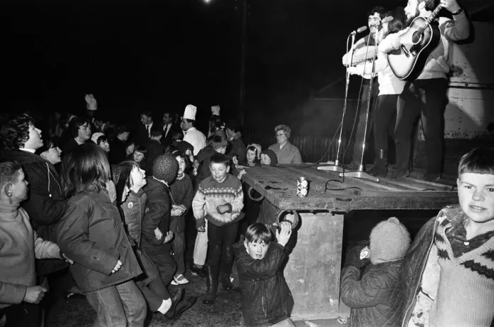 Framed Print : People watching live music during Aviemore Festival Week