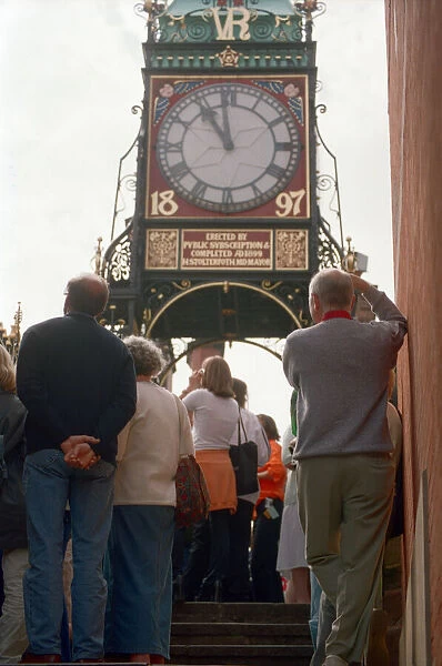 People watching the solar eclipse at the Eastgate and Eastgate Clock in Chester