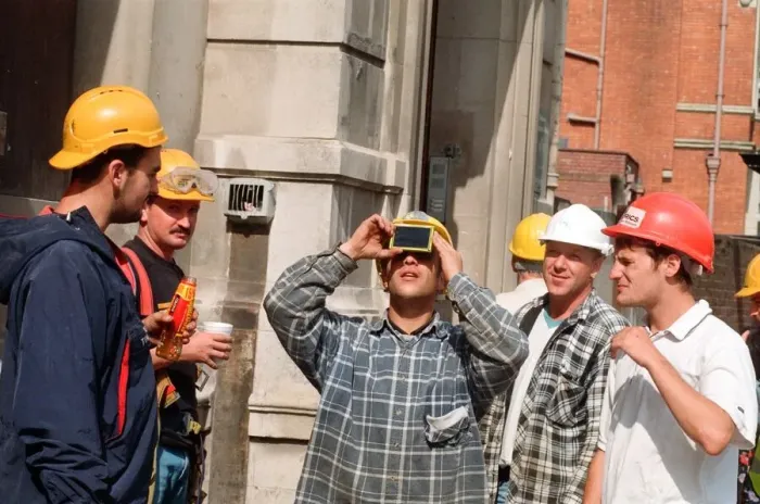 Framed Print : People watching a total solar eclipse, Queen Street, Cardiff. 11th August 1999 Framed Print : People watching a total solar eclipse, Queen Street, Cardiff. 11th August 1999