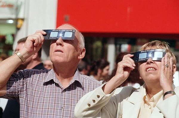 People watching a total solar eclipse, Queen Street, Cardiff. 11th August 1999