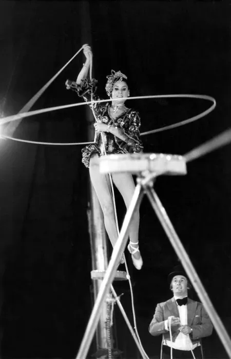 Framed Print : A performer rope twirling as they walk on the high wire Framed Print : A performer rope twirling as they walk on the high wire