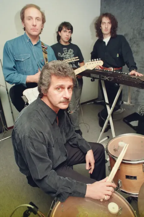 Framed Print : Pete Best, (in the black shirt holding his drum sticks) posing for the camera with his Framed Print : Pete Best, (in the black shirt holding his drum sticks) posing for the camera with his