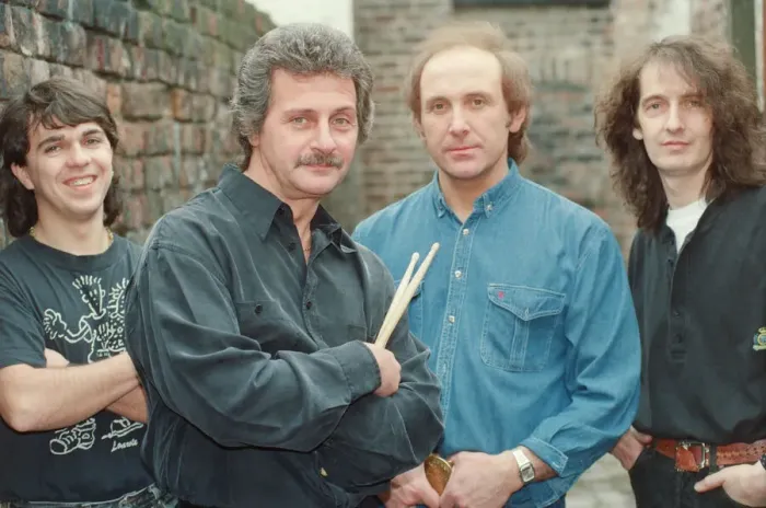 Framed Print : Pete Best, (in the black shirt holding his drum sticks) posing for the camera with his Framed Print : Pete Best, (in the black shirt holding his drum sticks) posing for the camera with his
