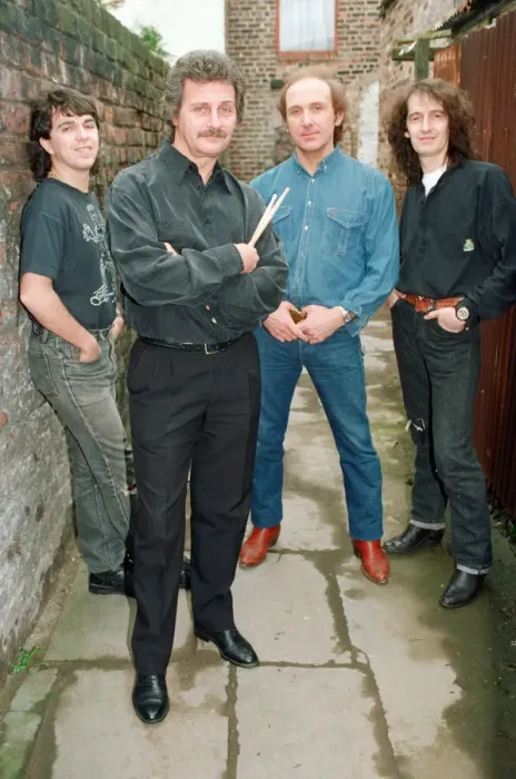 Framed Print : Pete Best, (in the black shirt holding his drum sticks) posing for the camera with his Framed Print : Pete Best, (in the black shirt holding his drum sticks) posing for the camera with his