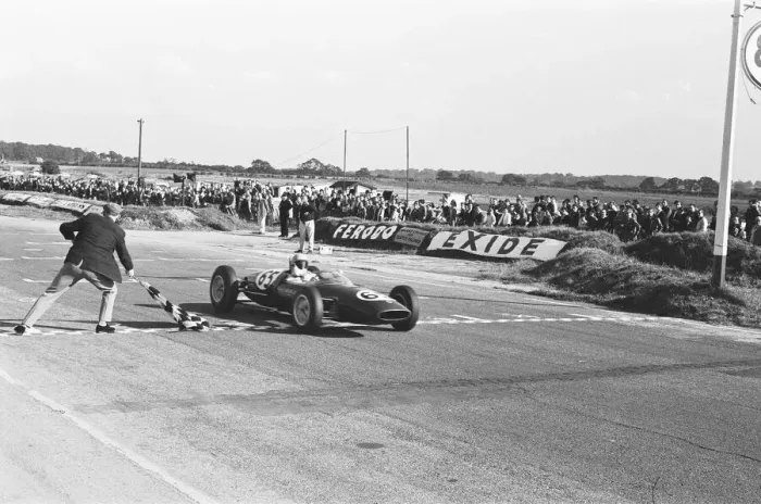 Framed Print : Peter Arundell in his Lotus 22 takes the checkered flag to win the Molyslip Trophy / IV Framed Print : Peter Arundell in his Lotus 22 takes the checkered flag to win the Molyslip Trophy / IV