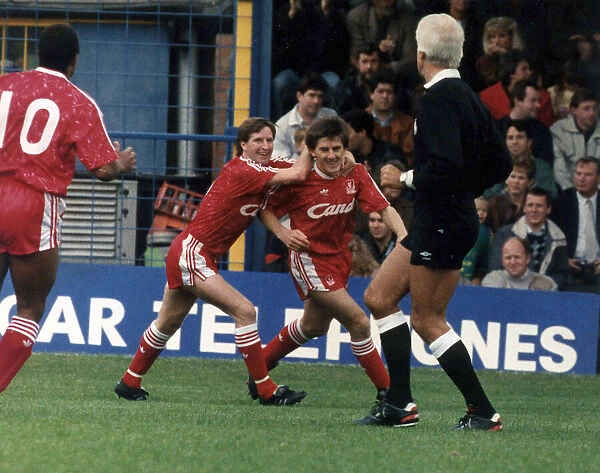 Peter Beardsley of Liverpool celebrating a goal with teammates Ronnie Whelan