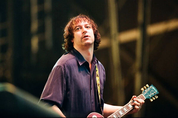 Peter Buck, R. E. M. in concert at the Galpharm Stadium. 25th July 1995