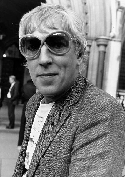 Peter Cook comedian actor outside law courts, October 1986