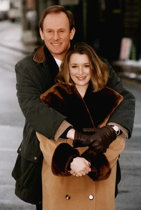 Framed Print : Peter Davison Actor in the BBC Comedy series Ain t Misbeahvin cuddles actress Lesley
