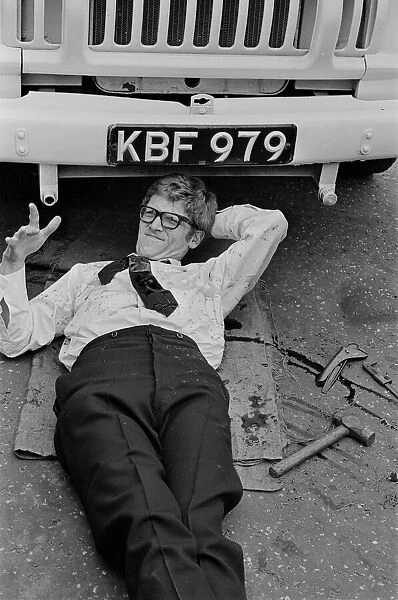 Peter Gilmore, on the floor, on the film set of Carry On Doctor