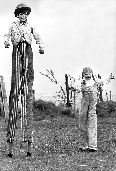 Peter and Julie Ann Jolly on stilts in their dads circus