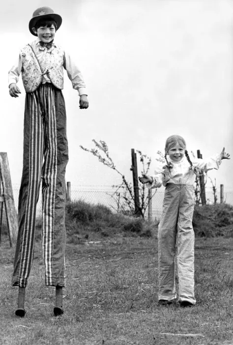 Framed Print : Peter and Julie Ann Jolly on stilts in their dads circus Framed Print : Peter and Julie Ann Jolly on stilts in their dads circus