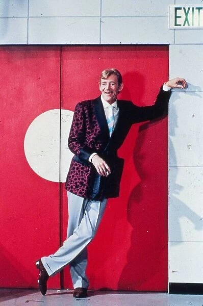 Peter O Toole actor wearing smoking jacket January 1988 leaning at exit door