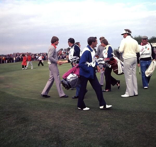 Peter Oosterhuis and Nick Faldo of the European Ryder Cup team shaking hands with their