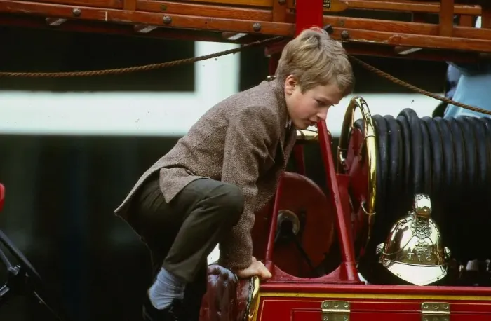 Framed Print : Peter Phillips January 1988 son of Princess Anne scrambles over top of old fire