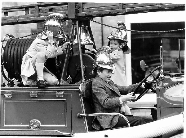 Peter Phillips takes over the driving of the vintage 1939 fire engine with Prince William