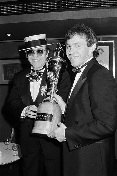 Peter Reid of Everton FC with Elton John at the PFA Players Player of the Year event